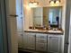 Clean bathroom with double vanity and ample storage at 322 Blackburn Blvd, North Port, FL 34287