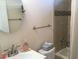 Bathroom features a tub, toilet, and vanity at 322 Blackburn Blvd, North Port, FL 34287