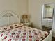 Bedroom with white bed frame and en-suite bathroom at 322 Blackburn Blvd, North Port, FL 34287