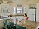 Modern kitchen with white cabinets, granite countertops and island at 322 Blackburn Blvd, North Port, FL 34287
