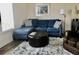 Cozy living room featuring a sectional sofa and comfortable seating at 322 Blackburn Blvd, North Port, FL 34287