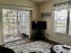Bright living room with sliding doors leading to a balcony at 322 Blackburn Blvd, North Port, FL 34287