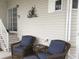 Screened porch with seating area at 322 Blackburn Blvd, North Port, FL 34287
