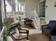 Screened porch with seating area and table at 322 Blackburn Blvd, North Port, FL 34287