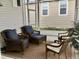 Relaxing screened porch with wicker furniture, perfect for enjoying the outdoors at 322 Blackburn Blvd, North Port, FL 34287