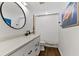 Bathroom with white vanity, round mirror, and white shower curtain at 3409 Anchor Bay Trl, Lakewood Ranch, FL 34211