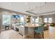 Modern community kitchen with a large island and bar seating at 3409 Anchor Bay Trl, Lakewood Ranch, FL 34211