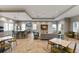 Community room with kitchen, seating area, and herringbone floors at 3409 Anchor Bay Trl, Lakewood Ranch, FL 34211