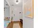 Light and bright entryway with wood flooring and bench at 3409 Anchor Bay Trl, Lakewood Ranch, FL 34211