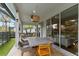 Covered patio with outdoor dining furniture and view of the backyard at 3409 Anchor Bay Trl, Lakewood Ranch, FL 34211