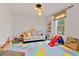 Fun playroom with colorful mats and ' furniture at 3409 Anchor Bay Trl, Lakewood Ranch, FL 34211