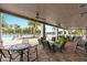 Relaxing pool area with covered seating and tables at 3409 Anchor Bay Trl, Lakewood Ranch, FL 34211