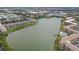Aerial view of community by the lake, showing buildings and a pool at 3622 Lake Bayshore Dr # K302, Bradenton, FL 34205