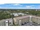 Aerial view of community with multiple buildings, parking, and lush landscaping at 3622 Lake Bayshore Dr # K302, Bradenton, FL 34205