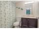Bathroom with a shower/tub combo and dark vanity at 3622 Lake Bayshore Dr # K302, Bradenton, FL 34205