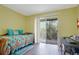 Bedroom with a daybed and access to a private balcony at 3622 Lake Bayshore Dr # K302, Bradenton, FL 34205