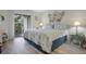 Main bedroom with a king-size bed and balcony access at 3622 Lake Bayshore Dr # K302, Bradenton, FL 34205