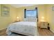 Bedroom with a queen bed and ocean-themed decor at 3622 Lake Bayshore Dr # K302, Bradenton, FL 34205