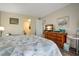 Main bedroom with king-size bed and dresser at 3622 Lake Bayshore Dr # K302, Bradenton, FL 34205