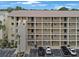 Exterior view of a multi-story building with parking at 3622 Lake Bayshore Dr # K302, Bradenton, FL 34205