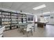 Community room with library, pool table, and card table at 3622 Lake Bayshore Dr # K302, Bradenton, FL 34205