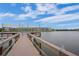 Community dock with shaded seating overlooking a tranquil lake at 3622 Lake Bayshore Dr # K302, Bradenton, FL 34205