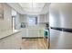 Condo kitchen with granite countertops and stainless steel appliances at 3622 Lake Bayshore Dr # K302, Bradenton, FL 34205