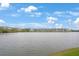Scenic view of the lake and community buildings at 3622 Lake Bayshore Dr # K302, Bradenton, FL 34205
