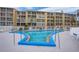 Refreshing kidney-shaped pool with ample deck space for lounging at 3622 Lake Bayshore Dr # K302, Bradenton, FL 34205