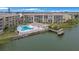 Community pool and private dock with lake access at 3622 Lake Bayshore Dr # K302, Bradenton, FL 34205