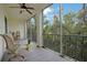 Relaxing screened porch with outdoor seating and tranquil wooded views at 3622 Lake Bayshore Dr # K302, Bradenton, FL 34205
