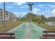 Shuffleboard court with benches overlooking the lake at 3622 Lake Bayshore Dr # K302, Bradenton, FL 34205