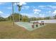 Shuffleboard court with benches and palm trees at 3622 Lake Bayshore Dr # K302, Bradenton, FL 34205