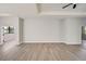 Spacious bedroom with light grey walls and wood-look flooring at 3850 Skyway Ave, North Port, FL 34288