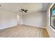 Bright and airy bedroom with hardwood floors and ceiling fan at 3850 Skyway Ave, North Port, FL 34288