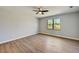 Well-lit bedroom with hardwood floors and window at 3850 Skyway Ave, North Port, FL 34288