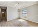 Dining area with chandelier and view into hallway and bathroom at 3850 Skyway Ave, North Port, FL 34288