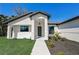 Front view of a house with walkway leading to the front door at 3850 Skyway Ave, North Port, FL 34288