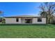Back of house showing large backyard at 3850 Skyway Ave, North Port, FL 34288