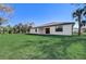 View of the back of the house and yard at 3850 Skyway Ave, North Port, FL 34288