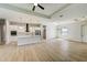 Modern kitchen with white cabinets, large island, and pendant lighting at 3850 Skyway Ave, North Port, FL 34288
