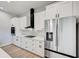 Modern kitchen with white cabinets and stainless steel appliances at 3850 Skyway Ave, North Port, FL 34288