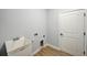 Laundry room with utility sink and built-in storage at 3850 Skyway Ave, North Port, FL 34288