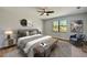 Main bedroom with plush bed and sitting area at 3850 Skyway Ave, North Port, FL 34288