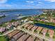 Wide aerial view of waterfront community with single Gathering home highlighted at 3904 Waypoint Ave, Osprey, FL 34229