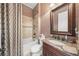 Small bathroom with tub shower and granite vanity at 3904 Waypoint Ave, Osprey, FL 34229