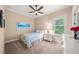 Bright bedroom with a gold bed frame and window shutters at 3904 Waypoint Ave, Osprey, FL 34229