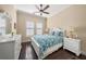 Cozy bedroom with white furniture and dark hardwood floors at 3904 Waypoint Ave, Osprey, FL 34229