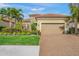 Single story home with tile roof, landscaping and two-car garage at 3904 Waypoint Ave, Osprey, FL 34229