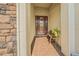 Bright and airy front entry with a welcoming bench at 3904 Waypoint Ave, Osprey, FL 34229